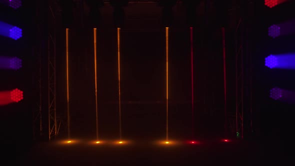 Empty Stage with Colorful Bright Spotlights and Hologram Laser Beams alt