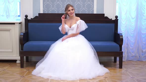 Beautiful Blonde Bride Poses in a Chic Rich Indoor