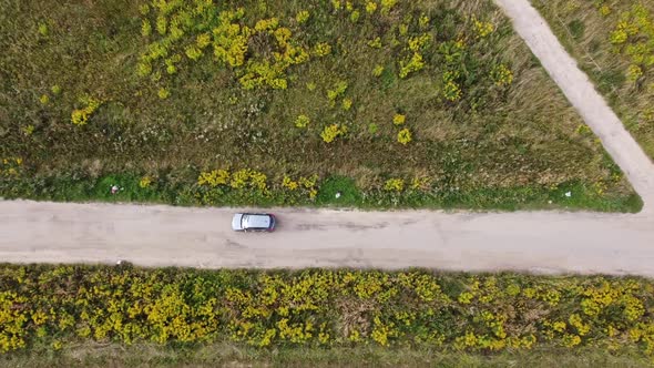 car drives along a country road