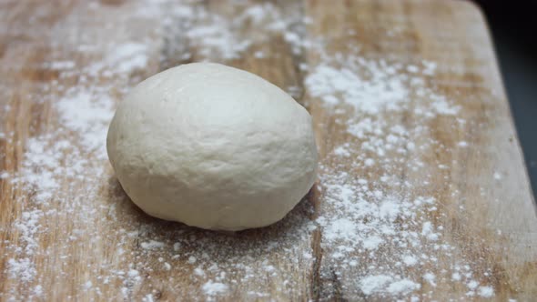 Piece of Dough Ready to Be Mold to Prepare Tuna Pizza alt