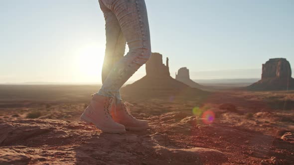 Traveler Woman Resting Outdoors on Rocky Mountain with Canyon Valley Landscape alt