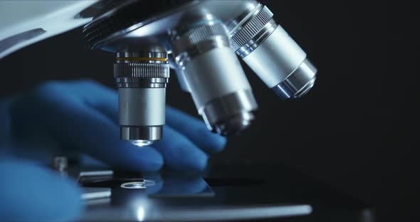 Crop Closeup Shot of Microscope in the Laboratory, Scientist Is Conducting Study Examines alt