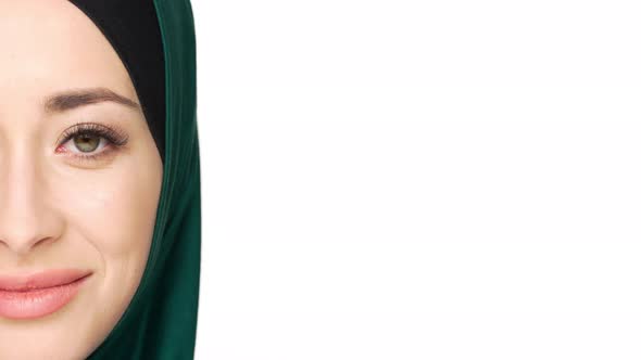 Halfside Portrait of Gorgeous Muslim Woman in Headscarf Posing on Camera with Charming Look and alt