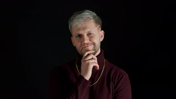 Thinking Man Looking Up and Around Contemplating How to Solve Problem Against Black Background alt