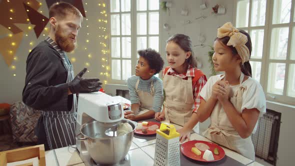 Chef Explaining Recipe to Kids on Cooking Masterclass alt