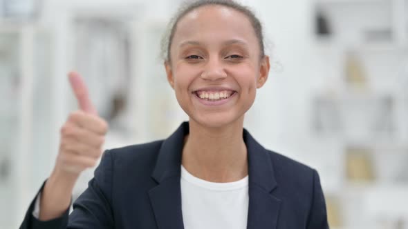 Portrait of Positive African Businesswoman Doing Thumbs Up  alt