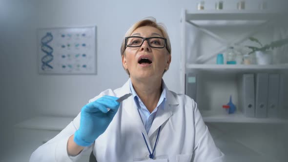 Female Therapist Examining Patients Throat With Tongue Depressor Healthcare, Pov