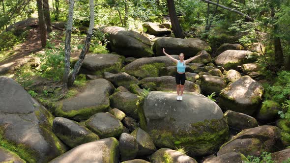 A Girl Practices Yoga in the Jungle alt