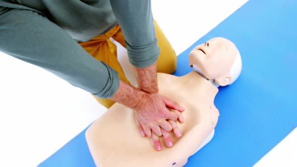 Male paramedic during cardiopulmonary resuscitation training alt