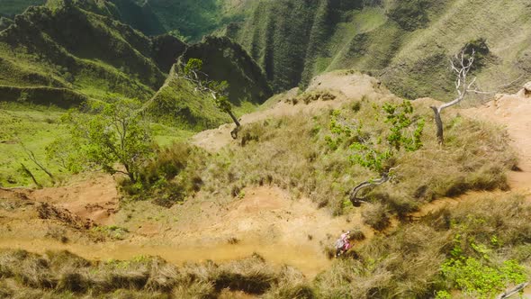Aerial View Female Hiker Walking Along Trail Path on Sunny Day People Hiking alt