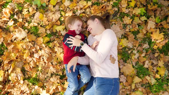 Video of Little Toddler Boy with Mother Playing, Tickling Each Other, Hugging and Kissing While alt