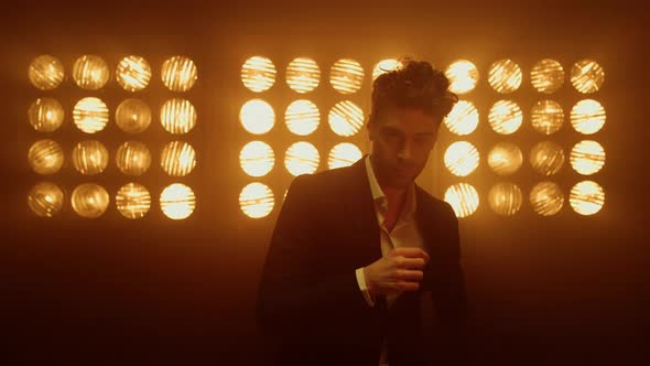 Sexy Male Model Costume Posing Confidently in Night Club Lights alt