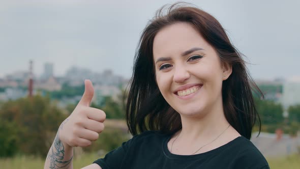 Beautiful Smiling Brunette Woman Girl Female Model Student with Tattoo on Hand Stand Outdoors Urban alt