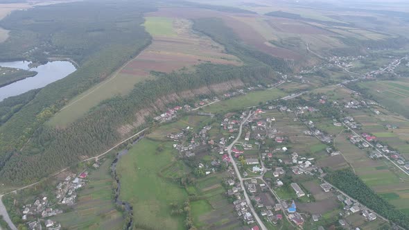 Aerial of a town near a river alt