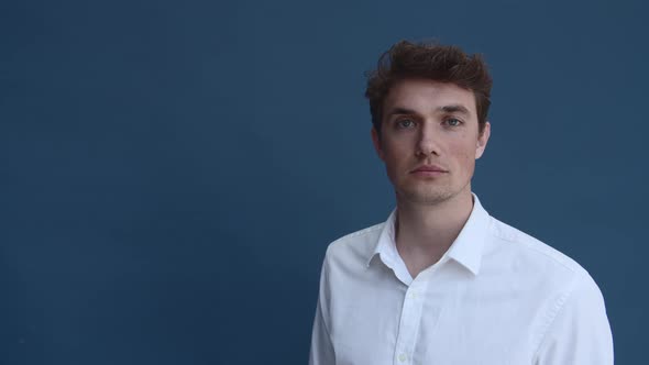 Caucasian Male Model in White Polo Standing Still alt