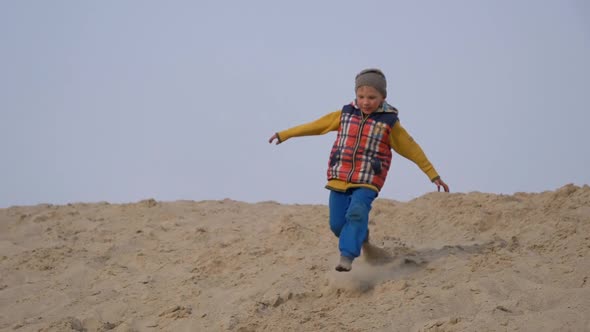 Children and Teenagers Have Fun on the White Sand. Parkour