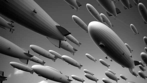 Large fleet of dirigibles. Airships are flying diagonally  across the frame. alt