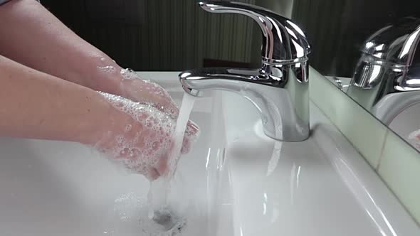 Woman Washes His Hands With Soap