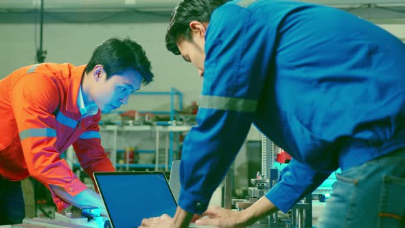 smart asian technical engineer working with assemble involved in the machine working design process alt