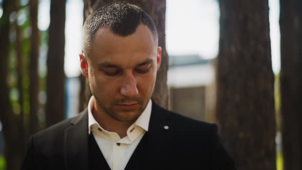 Gentleman in Black Costume with Shirt in Spring City Park alt