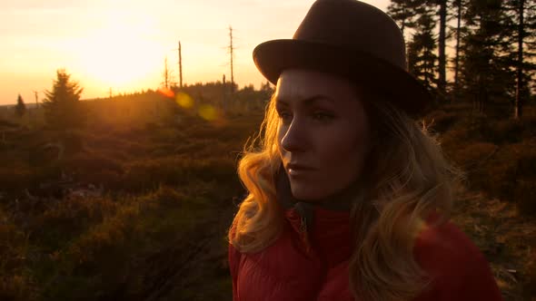 caucasian female hiker traveller portrait during sunset