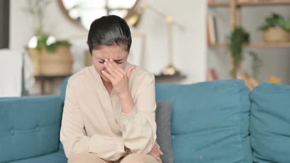 Indian Woman Sitting and Crying on Sofa  alt