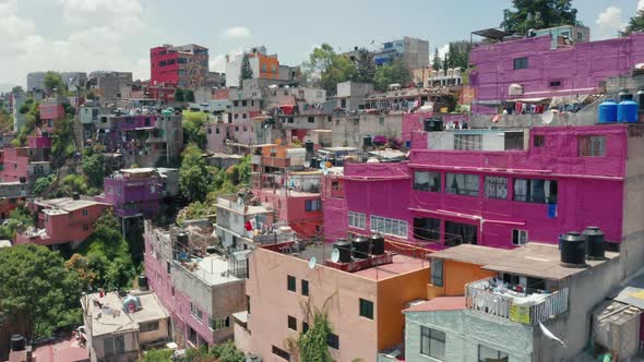 Drone Is Flying Along Colorful Slum Suburban District in Mexico City alt