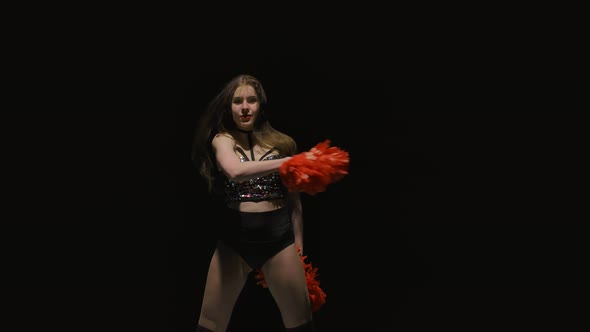 Cheerleader in Shiny Top Dances Vigorously and Waves Her Pompoms alt