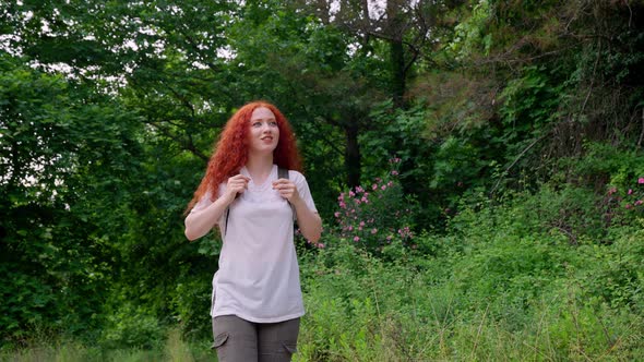 Cute Young Girl Walking Outdoors alt