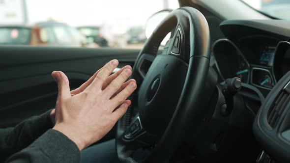 Man Driving in Innovative Automated Car Using Selfparking Autopilot for Parking on Parking Lot alt