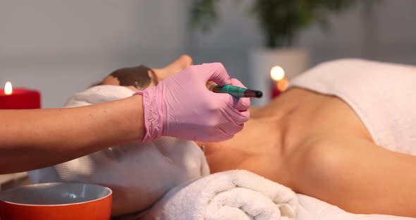 Spa Therapy for Woman and Receiving Black Face Mask alt