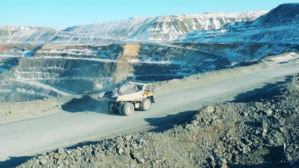 Opencut Mine with a Truck Transporting Copper alt