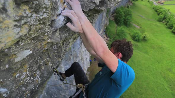 A man rock climbing up a mountain. alt