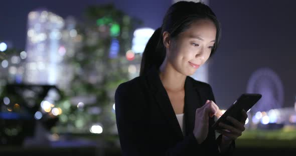 Business woman use of cell phone in city  alt