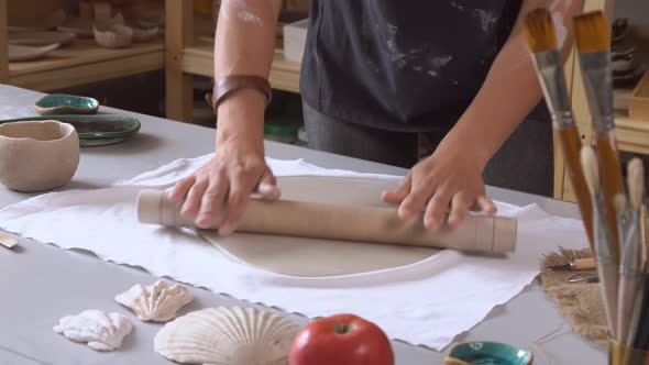 Close Up Woman Rolling Clay Craftsman Skill Concept.