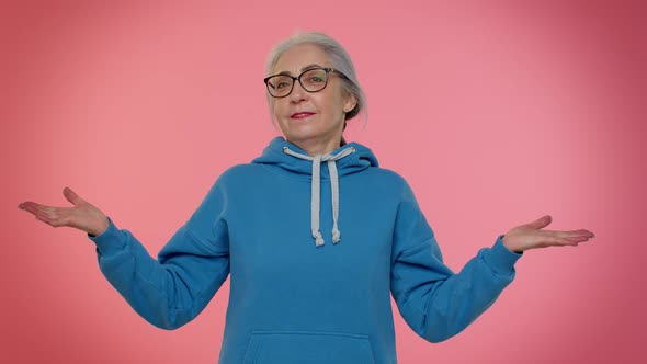 Elderly Woman Raising Hands in Indignant Expression Asking Why What Reason of Failure Irritation alt