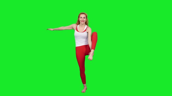 Slim Sporty Woman Standing On One Leg And Stretching During Yoga, Chroma Key