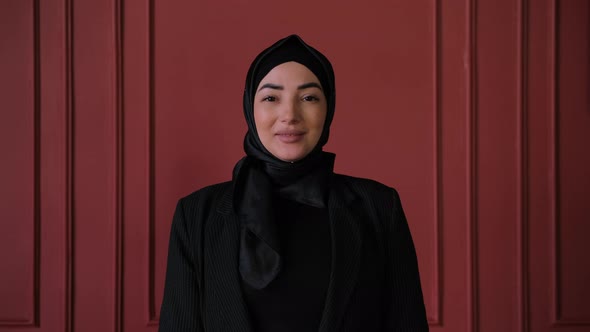 Young Muslim Business Woman in Hijab Smiling Happy Enjoying Successful