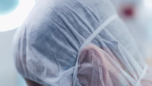 Close Up Footage of Scientist Eyes in Glasses Turning His Head To the Camera alt