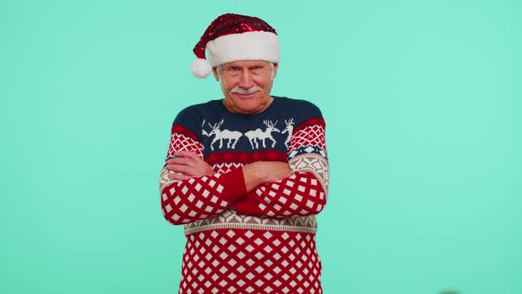 Elderly Senior Lovely Grandfather Man Wears Red New Year Sweater and Hat Smiling Looking at Camera alt