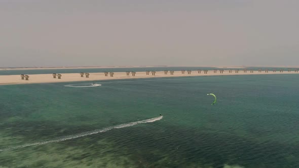 Aerial view of people practicing windsurfing at Jumeirah beach, U.A.E. alt