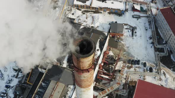 Aerial Video on the Chimney of an Power Plant From Which White Smoke Comes Out alt