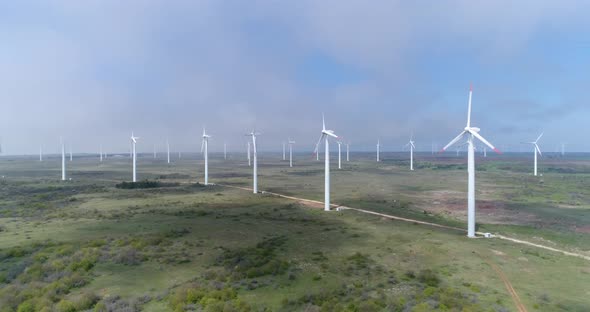 windmills farm. Modern wind turbines. Wind is cleanest, renewable electric energy source. alt