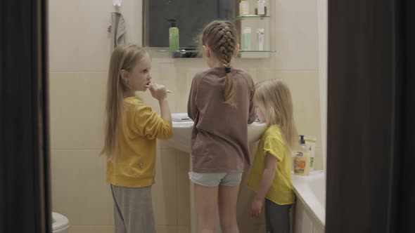Children Brush Their Teeth