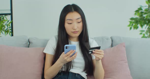 Asian Woman Buys Something Using Phone Credit Card Ecommerce Internet alt
