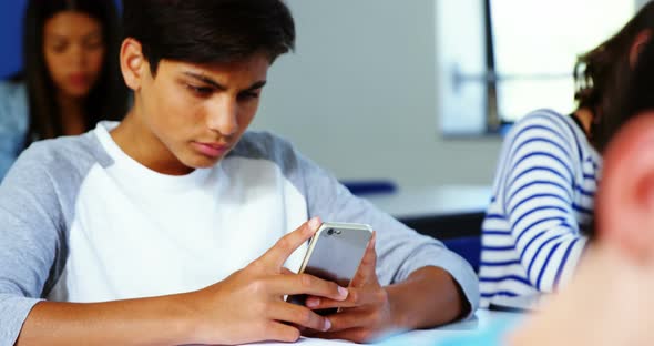 Student using mobile phone in classroom, Stock Footage | VideoHive