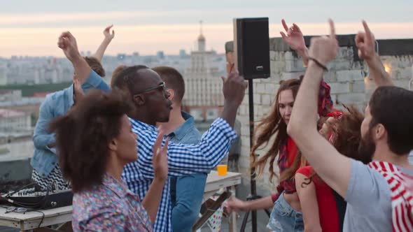 Energetic Clubbers Dancing at Rooftop Day Party alt