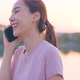 Asian young woman stand outdoor use mobile phone call talk with friend. - VideoHive Item for Sale