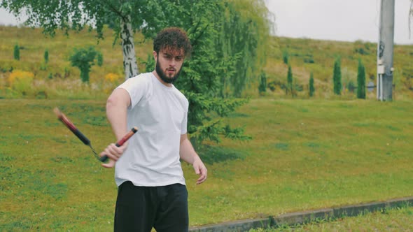 Man Twists Nunchucks alt