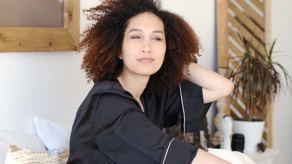 Happy African American Woman with Beautiful Face White Teeth and Curly Hairstyle Looking at Camera alt